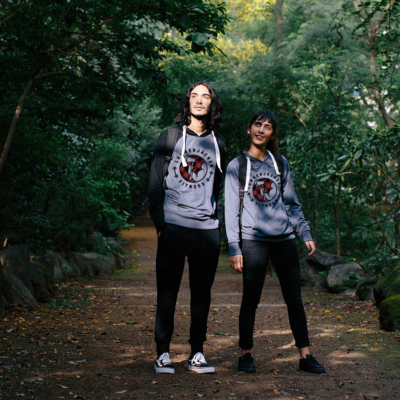 Two runners wearing Lumberjacked Fitness branded hoodies